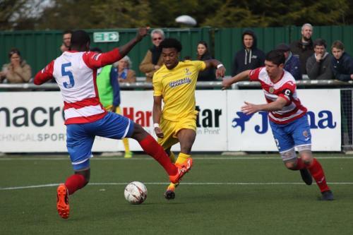Harlows Ibrahima Sonko (5) blocks Dernell Wynters shot