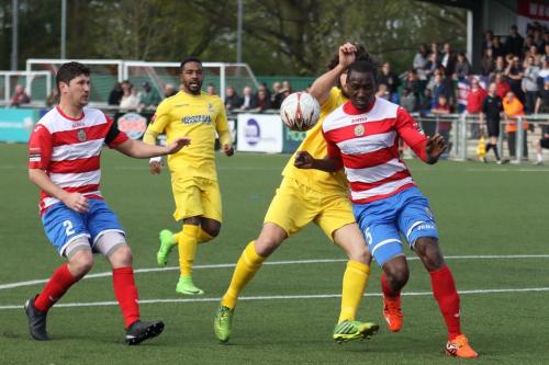 Harlows Ibrahima Sonko (R) just beats Harry Ottaway to the ball watched by Craig Pope (L) and Bobby Devyne