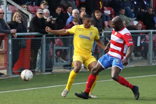 Harlows Junior Dadson (R) tackles Jonathan Muleba