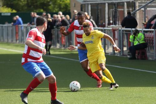 Harlows Stanley Muguo challenges Tyler Campbell as Craig Pope covers