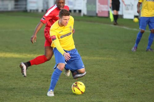 Enfields Billy Crook (yellow) and Harrows Francis Babalola