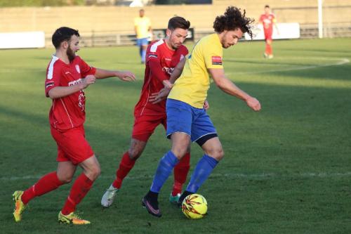 Enfields Harry Ottaway challenged by Andy Lomas (L) and Josh Webb