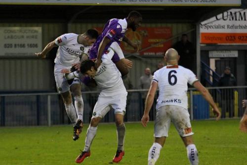 Enfields Harold Joseph (purple) challenges Jason Prior (L) and Andreas Robinson