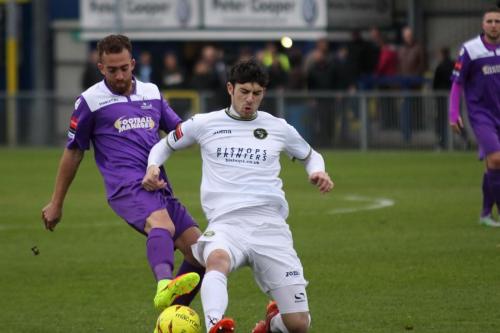 Enfields Scott Shulton (L) challenges Andreas Robinson