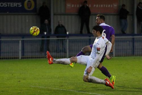 Enfields Scott Shulton shoots despite Andreas Robinsons attempted block