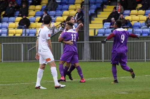 Enfields Tyler Campbell (11) and Bobby Devyne (9) congratulate Harry Ottaway on the opening goal