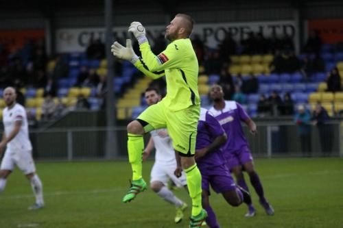 Havant keeper Ryan Young comes out to collect a cross