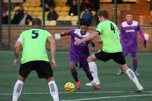Dernell Wynter runs at Hendons Arthur Lee (5) and Bradley Hewitt