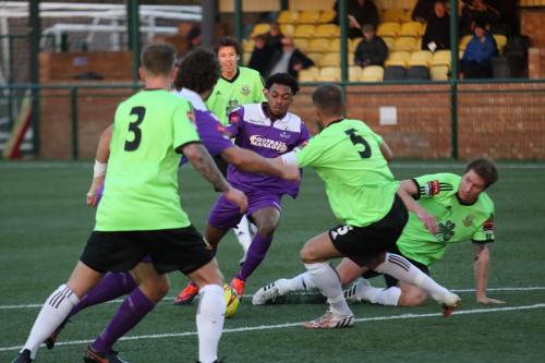 Enfields Dernell Wynter seems to be well covered but he still manages to get a shot on target