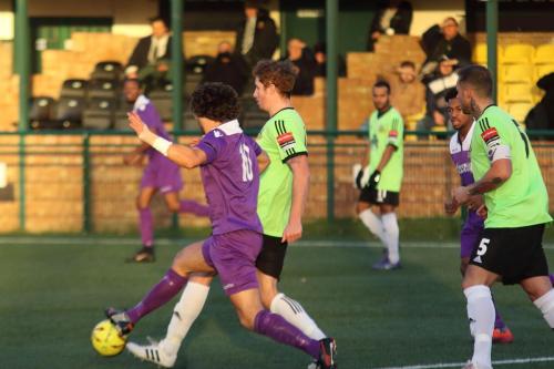Enfields Harry Ottaway (purple) and Hendons Bradley Hewitt