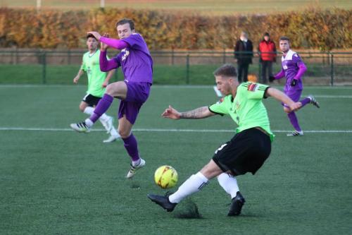 Enfields Mickey Parcell tries to charge down a clearance from Oliver Sprague
