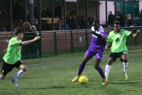 Enfields Percy Kiangebeni challenged by Sam Murphy (L) and Karl Oliyide