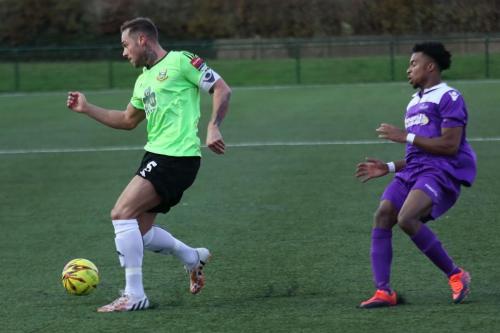 Hendons Arthur Lee (L) beats Dernell Wynter to the ball