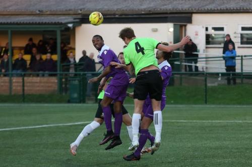 Hendons Bradley Hewitt (4) heads clear from Ricky Gabriel (L) and Harry Ottaway