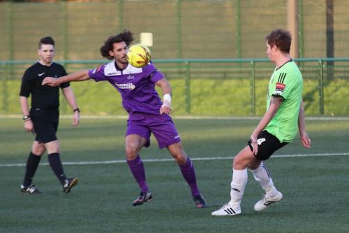 Hendons Bradley Hewitt (R) clears from Harry Ottaway
