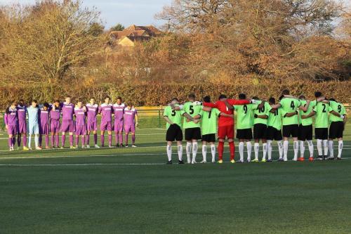 The teams line up for a minutes silence in memory of the victims of the plane crash in Colombia