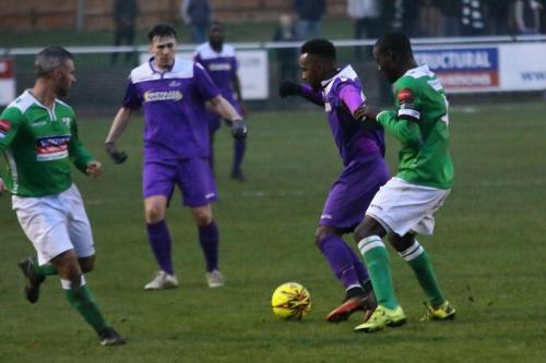 Enfields Bobby Devyne (purple, R) holds off Paul Semakula