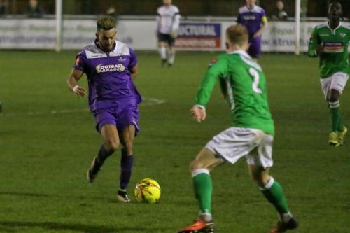 Enfields Tyler Campbell (L) runs at Adam Cash