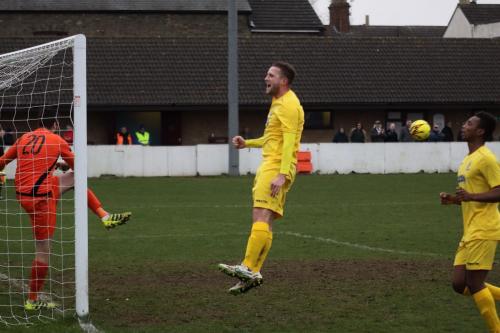 Billy Crook celebrates after giving Enfiled the lead from the penalty spot