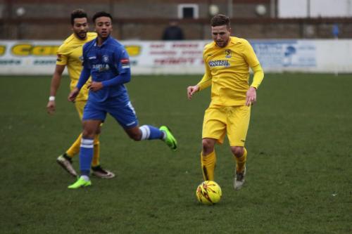 Enfields Billy Crook (R) and Tyler Campbell and Lowestofts Nico Cotton