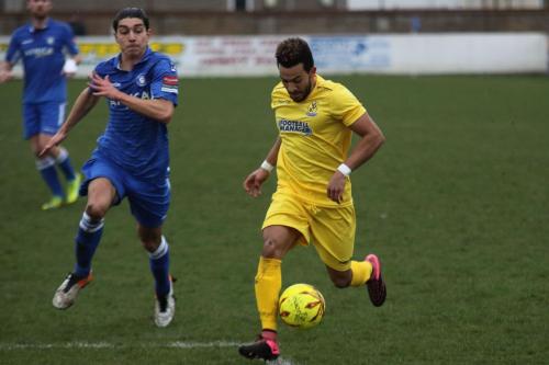 Enfields Tyler Campbell (R) runs into the box as Harry Barker tries to get back to challenge