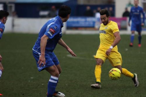 Enfields Tyler Campbell (yellow) runs at Harry Barker