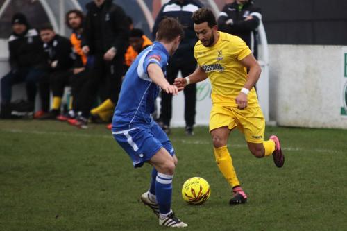 Enfields Tyler Campbell runs at Jamie Forshaw