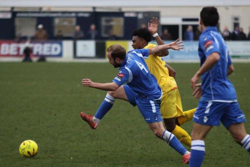 Lowestofts Andrew Fisk (4) challenges Dernell Wynter