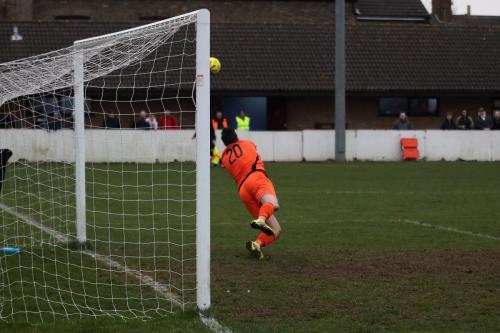 Lowestofts Jake Jessup turns a free kick past the post