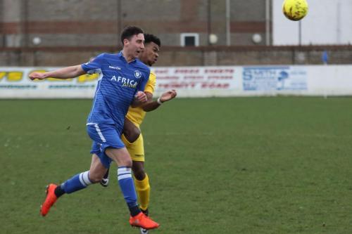 Lowestofts Travis Cole (blue and Enfields Dernell Wynter