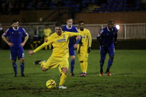 Enfields Billy Crook has a chance to make the score 2-1, but his penalty is saved