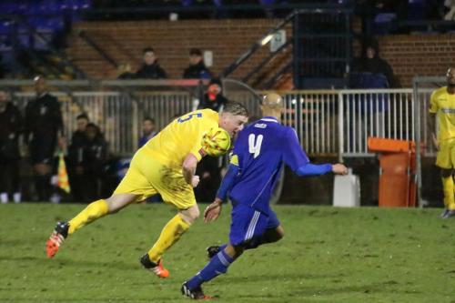 Enfields Mark Kirby (yellow) and Mets Steve Sutherland