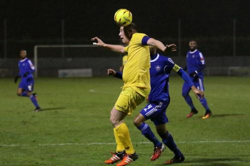 Enfields Mark Kirby heads clear from Steve Sutherland