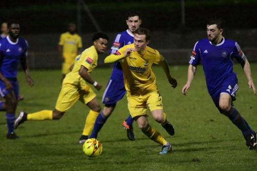 Enfields Mickey Parcell (yellow, R) takes the ball wide as Dernell Wynter moves inside