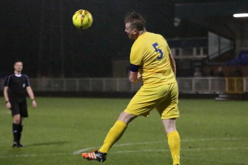 Mark Kirby heads clear