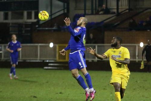 Mets Lloyd Macklin (L) and Enfields Harold Joseph