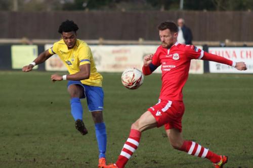 Enfields Dernell Wynter shoots past Ian Millers attempted block