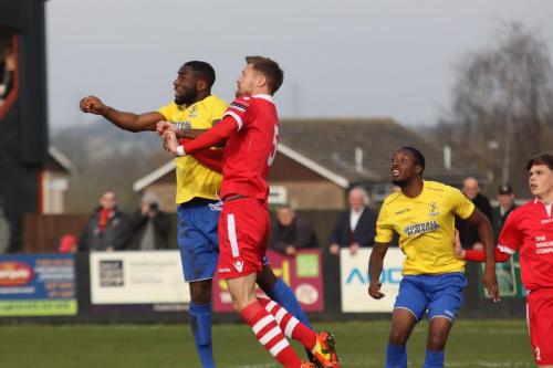 Enfields Harold Joseph (L) challenges Ian Miller