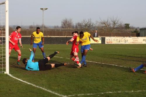 Enfields Harold Joseph (yellow) tries to score from the rebound after Danny Gays initial save