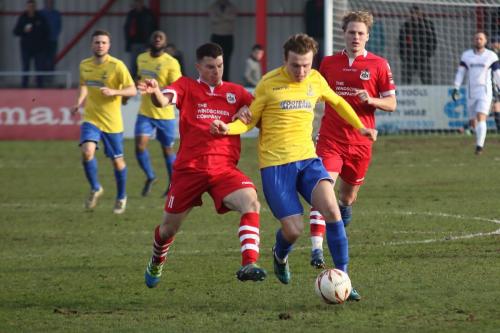 Enfields Mickey Parcell (yellow) and Needhams Jack Simmons (L) and Cameron Norman