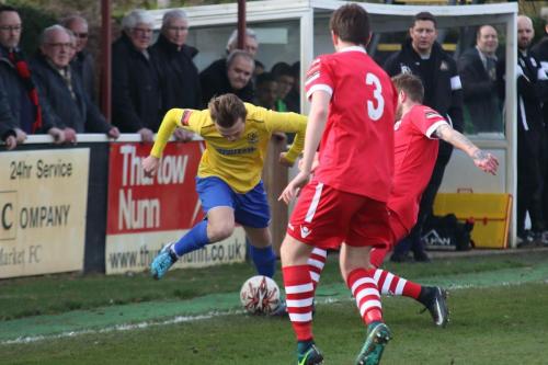 Enfields Mickey Parcell and Needhams Daryl Coakley (3) and Billy Clark