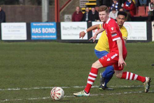 Enfields Nathan Livings (yellow) and Needhams Billy Holland