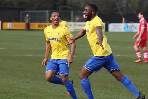 Jonathan Muleba (L) and Harold Joseph celebrate Josephs goal