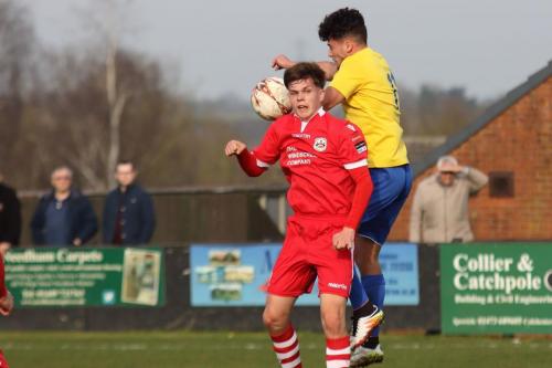 Needhams Jake Dye (red) and Enfields Samir Bihmoutine