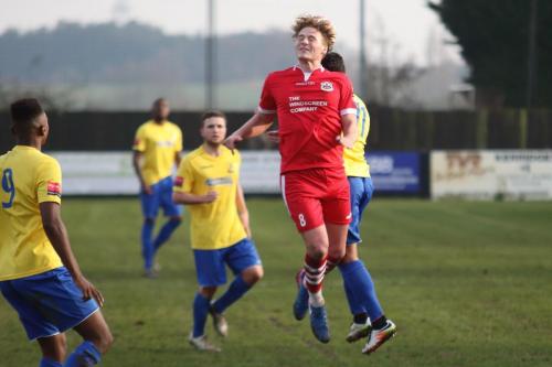 Needhams Keiran Morphew (red) challenges Samir Bihmoutine