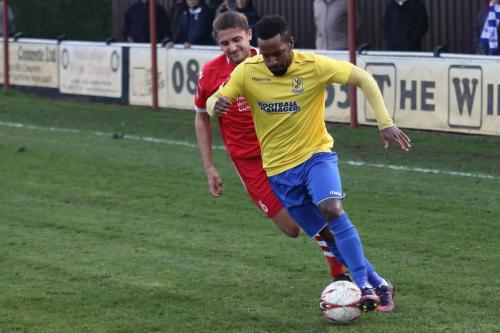 Needhams Will Crisell (red) and Enfields Bobby Devyne