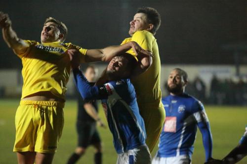 Enfields Blake Thompson (L) and Brad Quinton challenge Tom Parkinson