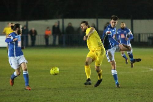 Enfields Harry Ottaway (yellow) challenges Tom Parkinson