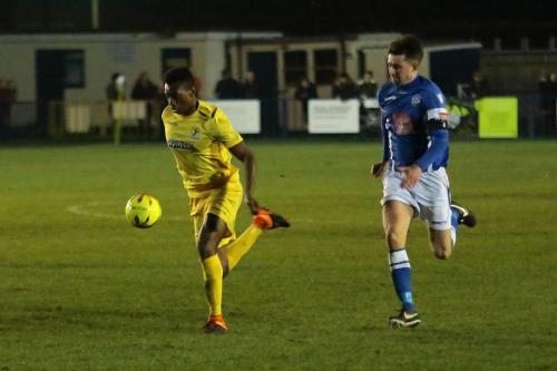 Enfields Karl Oliyide (L) and Angels Tom Parkinson