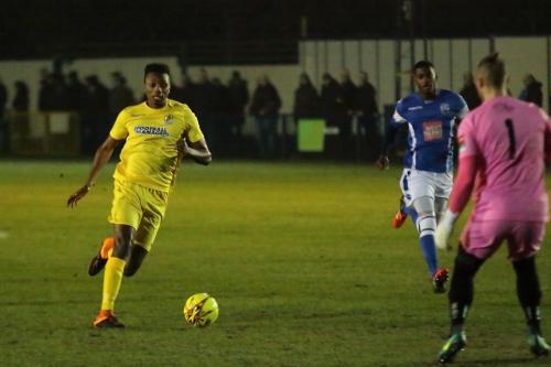 Karl Oliyide runs at Angels keeper Anthony di Bernardo, but from an offside position